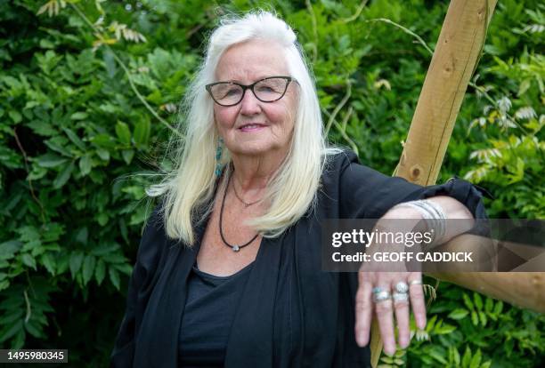 Aneira Thomas poses for a picture in her garden in Swansea on the south coast of Wales on July 3, 2023. Aneira Thomas holds the honour of being the...