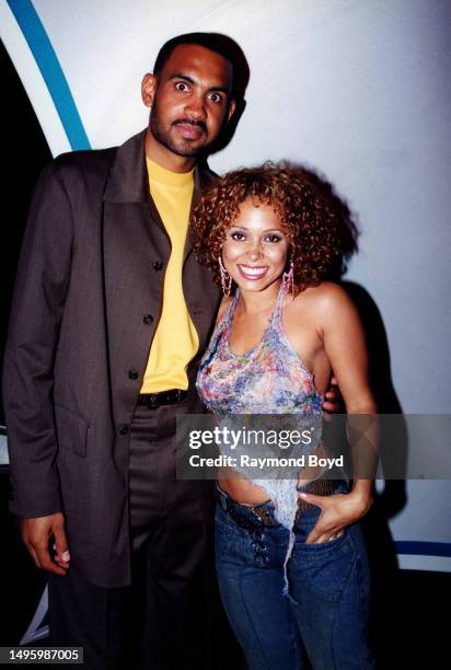 Singer Tamia poses for photos with her husband, Detroit Pistons basketball player Grant Hill after her performance at Kaleidoscope in Chicago,...