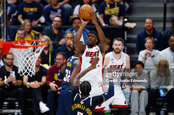 Jimmy Butler of the Miami Heat shoots over Kentavious Caldwell-Pope of the Denver Nuggets during the second quarter in Game Two of the 2023 NBA...