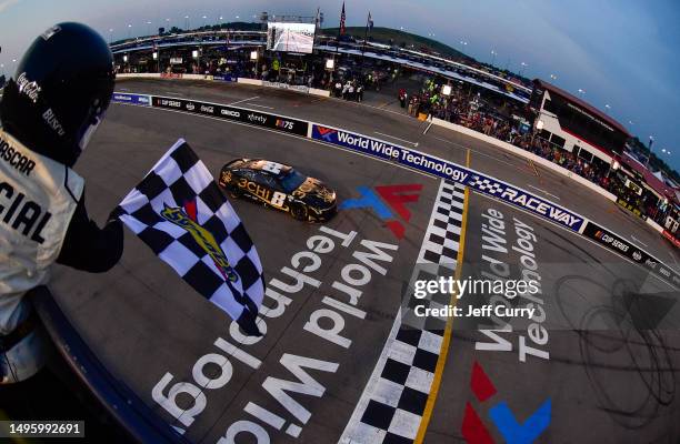 Kyle Busch, driver of the 3CHI Chevrolet, takes the checkered flag to win the NASCAR Cup Series Enjoy Illinois 300 at WWT Raceway on June 04, 2023 in...