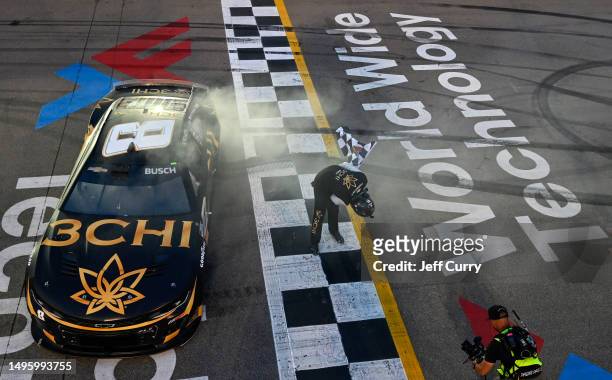Kyle Busch, driver of the 3CHI Chevrolet, takes a bow after winning the NASCAR Cup Series Enjoy Illinois 300 at WWT Raceway on June 04, 2023 in...