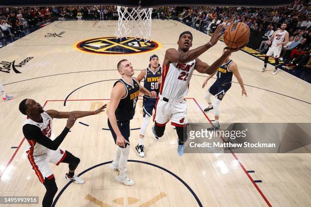 Jimmy Butler of the Miami Heat drives to the basket against Nikola Jokic of the Denver Nuggets during the first half in Game Two of the 2023 NBA...