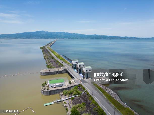 isahara bay polder dike in kyushu in japan - didier marti stock pictures, royalty-free photos & images