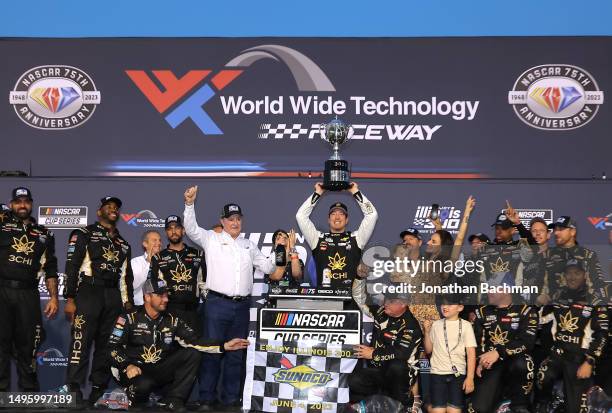 Kyle Busch, driver of the 3CHI Chevrolet, celebrates with RCR team owner and NASCAR Hall of Famer, Richard Childress and wife, Samantha Busch in...