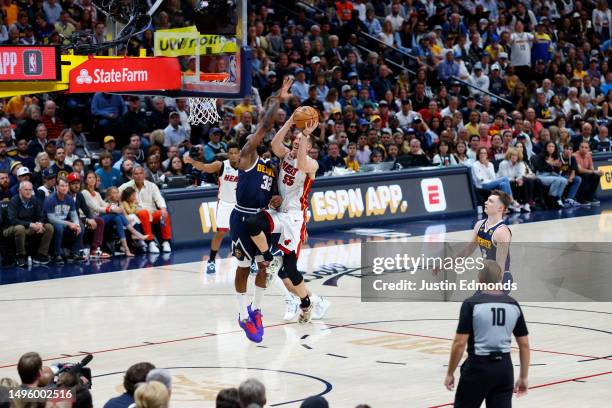 Duncan Robinson of the Miami Heat drives to the basket against Jeff Green of the Denver Nuggets during the fourth quarter in Game Two of the 2023 NBA...