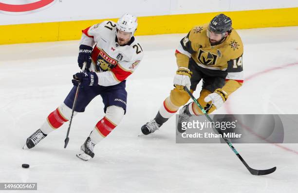 Nick Cousins of the Florida Panthers skates with the puck against Nicolas Hague of the Vegas Golden Knights in the third period of Game One of the...