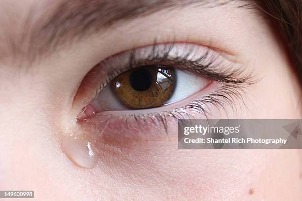 young girl with tears in eyes - eyes crying stock-fotos und bilder