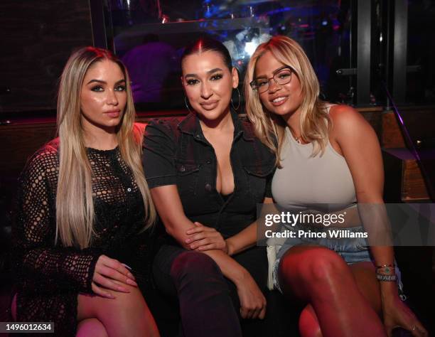 Florencia Silva, Monique Jacqueline and Halle Calhoun attend A Party hosted by Trey Songz at Bamboo Nightclub on June 3, 2023 in Atlanta, Georgia.