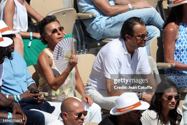 Maria Dowlatshahi and Henri Leconte attend the 2023 French Open at Stade Roland Garros on June 4, 2023 in Paris, France.