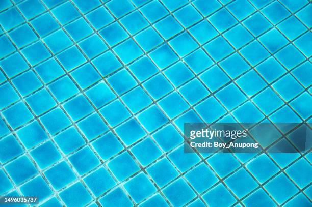 view of bottom caustics of swimming pool with ripple and flow on water surface. - water ripple stock-fotos und bilder