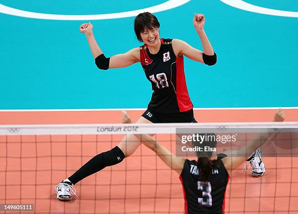 Saori Kimura and Yoshie Takeshita of Japan celebrate a point in the second set against Dominican Republic during Women's Volleyball on Day 5 of the...