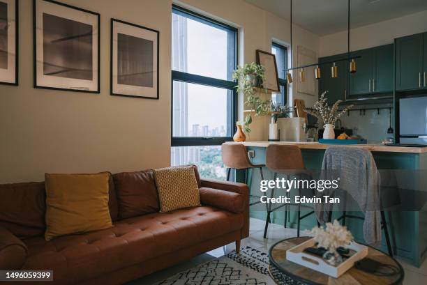 cozy small studio apartment with sofa and kitchen island - color enhanced stock pictures, royalty-free photos & images