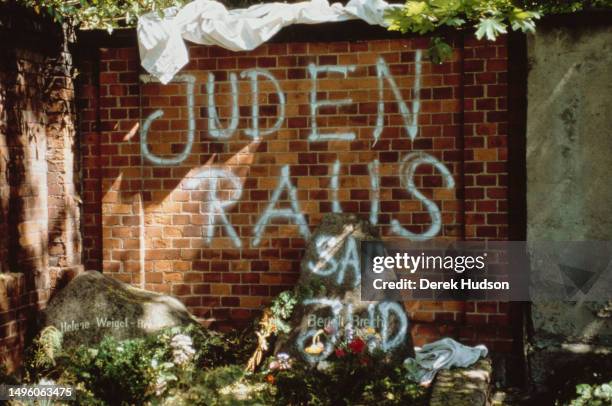 The graves of Bertolt Brecht and his wife Helene Weigel are daubed with anti-semitic graffiti, Dorotheenstadt Cemetery, West Berlin, West Germany,...
