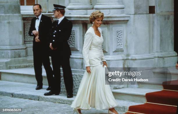 Diana, Princess of Wales arrives for Constantine II of Greece’s 50th birthday party wearing a white outfit, London, June 3rd 1990.