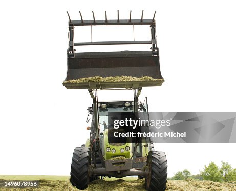front view tractor with a silage fork and work train