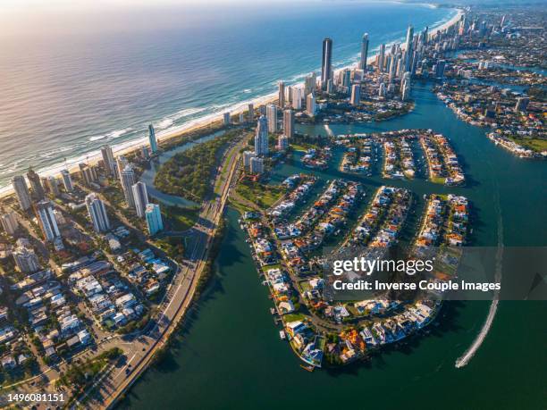 aerial view scene of gold coast beach behind around surfers paradise skyline, broadbeach and main beach with luxury hotel and apartment when sunrise time at gold coast - main beach gold coast stock pictures, royalty-free photos & images