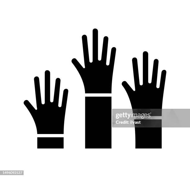 hands raised black filled vector icon - activist icon stock illustrations