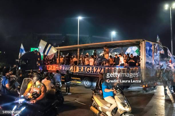 Napoli fans celebrate with pickup trucks and cars the victory of the Italian Championship and the Scudetto in front of the Maradona Stadium on June...