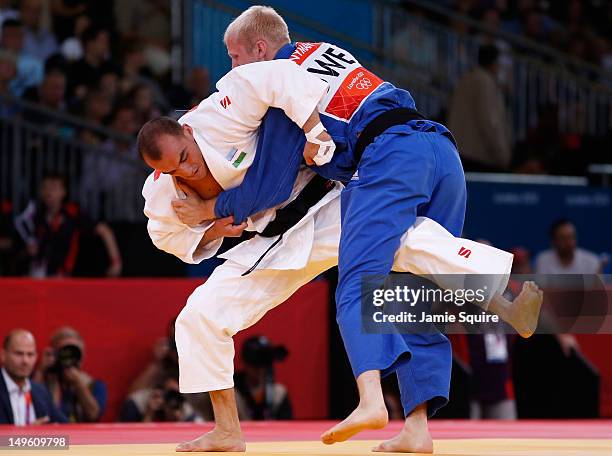 Asley Gonzalez Montero of Cuba competes with Hector Campos of Argentina during the Men's -90 kg Judo on Day 5 of the London 2012 Olympic Games at...