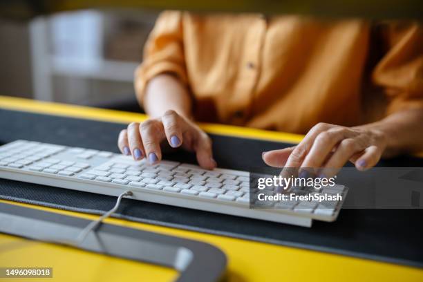 an unrecognizable businesswoman working in the office on her computer - copywriter stock pictures, royalty-free photos & images