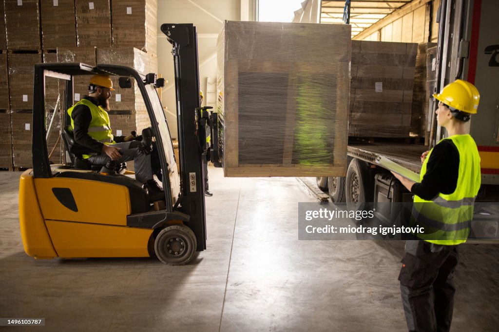 Loading Representative Warehouse Employees Loading Up A Truck Trailer High-Res Stock Photo ...