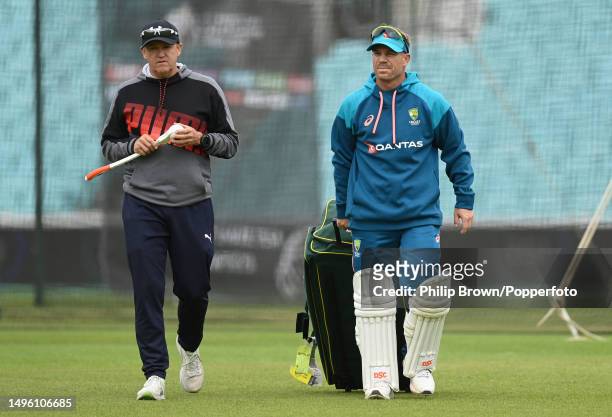 Andy Flower and David Warner of Australia walk from the net area aft an Australia training session prior to the ICC World Test Championship Final...
