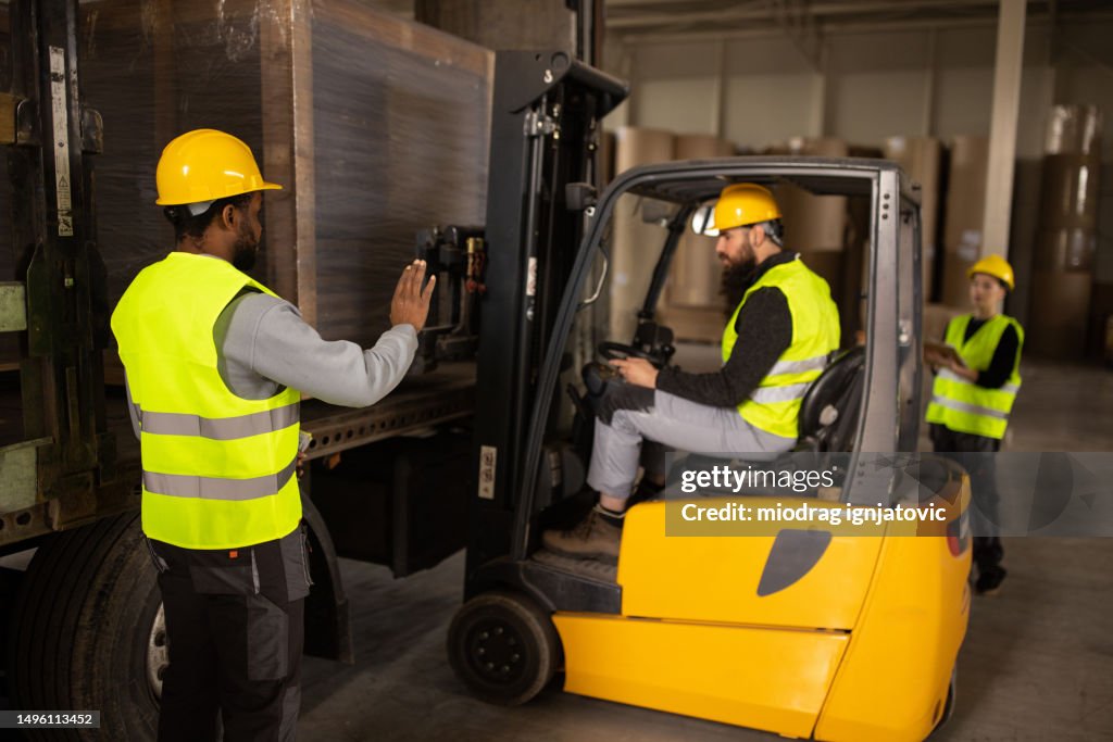 Man Machine Loading Young Man Loading A Truck Trailer Using A Forklift High-Res Stock Photo ...