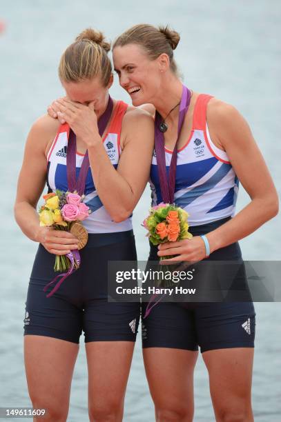 Helen Glover and Heather Stanning of Great Britain celebrate with their gold medals during the medal ceremony after the Women's Pair Final A on Day 5...