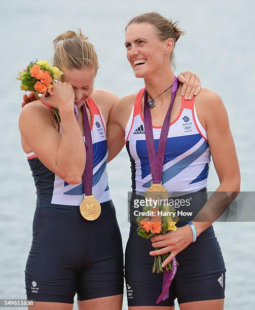 Helen Glover and Heather Stanning of Great Britain celebrate with their gold medals during the medal ceremony after the Women's Pair Final A on Day 5...