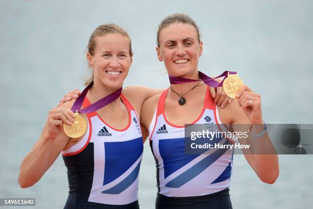 Helen Glover and Heather Stanning of Great Britain celebrate with their gold medals during the medal ceremony after the Women's Pair Final A on Day 5...