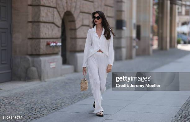 Celine Bethmann wears Hermes Chypre brown velvet leather sandals, Celine black shades, ninety9 matching white linen flannel and wide pants and Jimmy...