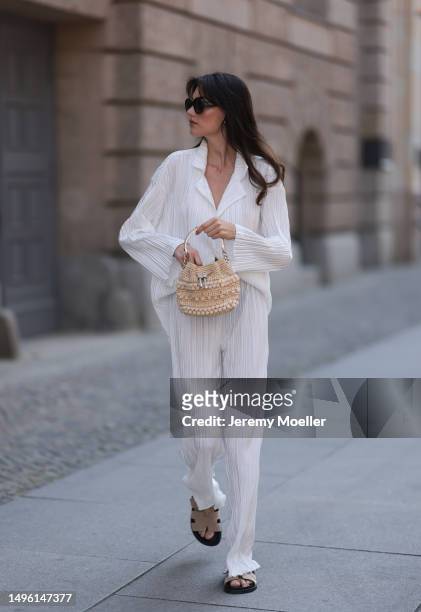 Celine Bethmann wears Hermes Chypre brown velvet leather sandals, Celine black shades, ninety9 matching white linen flannel and wide pants and Jimmy...