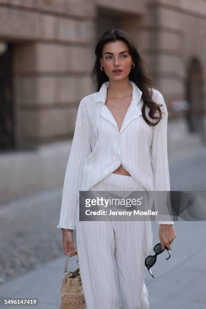 Celine Bethmann wears Hermes Chypre brown velvet leather sandals, Celine black shades, ninety9 matching white linen flannel and wide pants and Jimmy...
