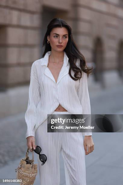 Celine Bethmann wears Hermes Chypre brown velvet leather sandals, Celine black shades, ninety9 matching white linen flannel and wide pants and Jimmy...