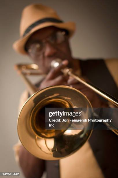 african american musician playing trombone - trombone stock pictures, royalty-free photos & images