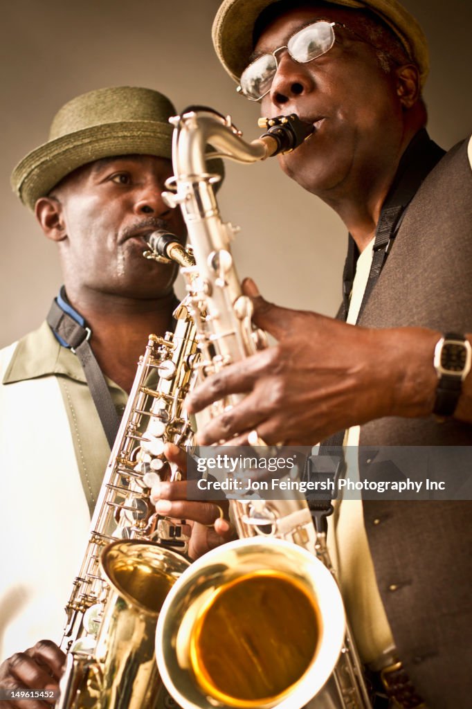 African American musicians playing saxophones together