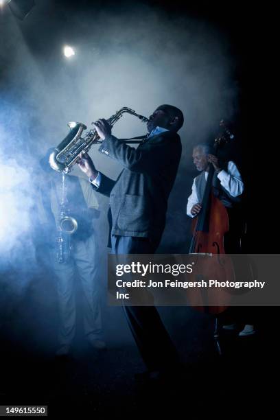 musicians playing in jazz band on stage - blues foto e immagini stock