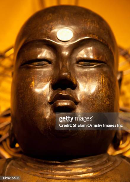 close up of golden buddha statue - buddha face stock pictures, royalty-free photos & images