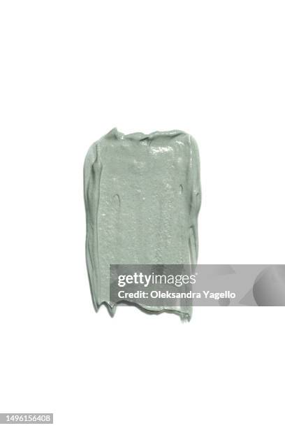 cosmetic swatch of clay. the texture of the face mask. beautiful green gray shades of strokes. - oily skin stock pictures, royalty-free photos & images