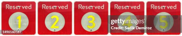 orange colored reserved signs over white - panneau espace réservé photos et images de collection