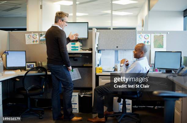 business people talking in office cubicle - office cubicle stock pictures, royalty-free photos & images