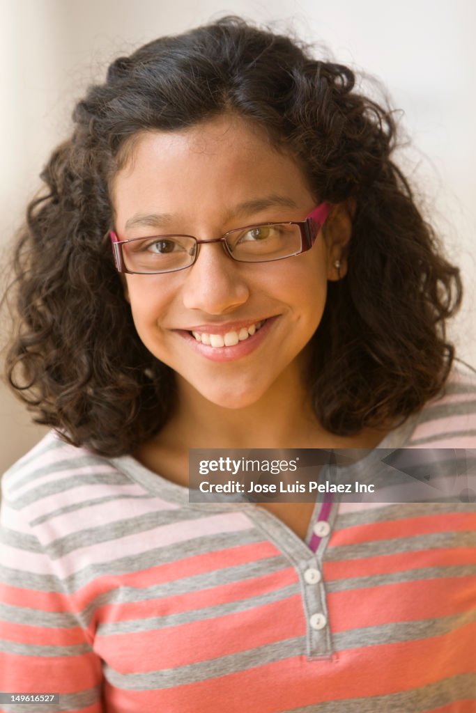 Smiling Hispanic girl in eyeglasses