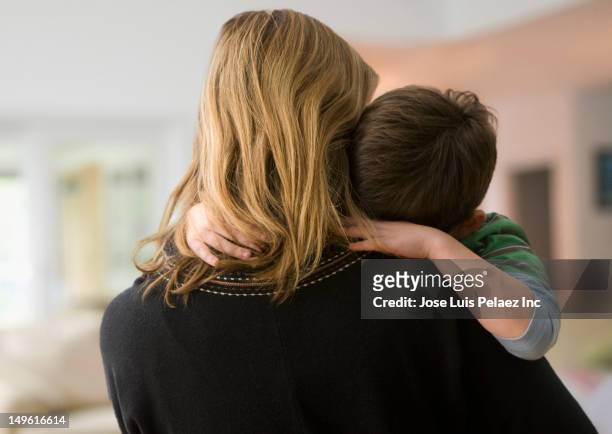 caucasian mother comforting son - unrecognizable person stock pictures, royalty-free photos & images