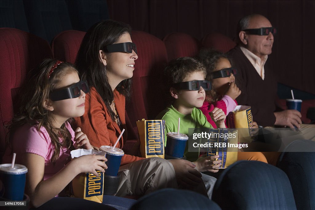Hispanic family watching 3D movie