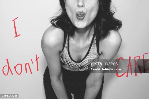 black and white fashion portrait with i don't care text - it girl stockfoto's en -beelden