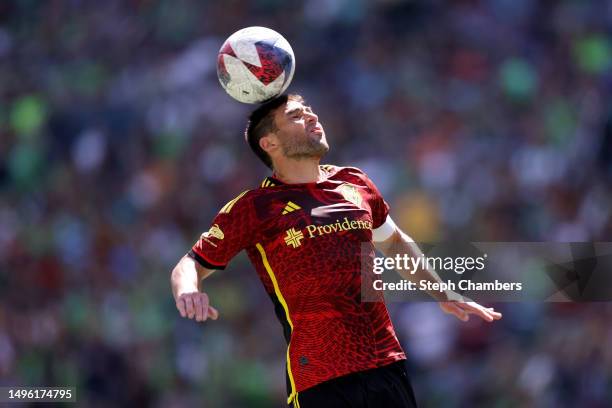 Nicolás Lodeiro of Seattle Sounders heads the ball against the Portland Timbers at Lumen Field on June 03, 2023 in Seattle, Washington.