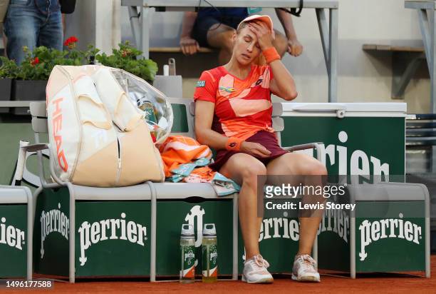 Lesya Tsurenko of Ukraine looks dejected during a break between as she retires against Iga Swiatek of Poland during the Women's Singles Fourth Round...