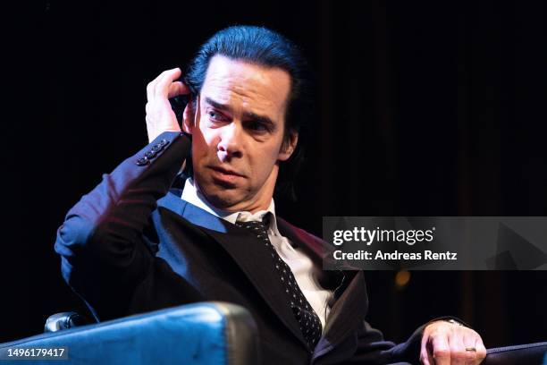 Musician and author Nick Cave gestures during lit.COLOGNE Spezial: Nick Cave & Seán O'Hagan: „Faith, Hope and Carnage" at Theater am Tanzbrunnen on...