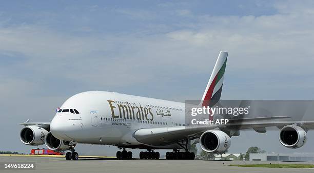 Emirates Airline's Airbus A380 lands for the first time at Schiphol Airport on August 1, 2012. The A380 is the largest and heaviest passenger plane...