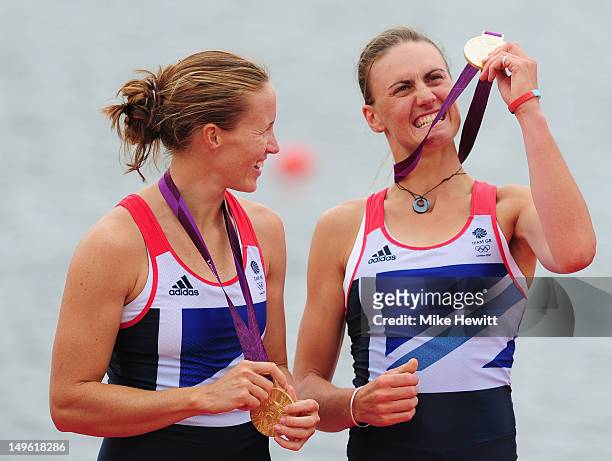 Helen Glover and Heather Stanning of Great Britain celebrate with their gold medals during the medal ceremony after the Women's Pair Final A on Day 5...